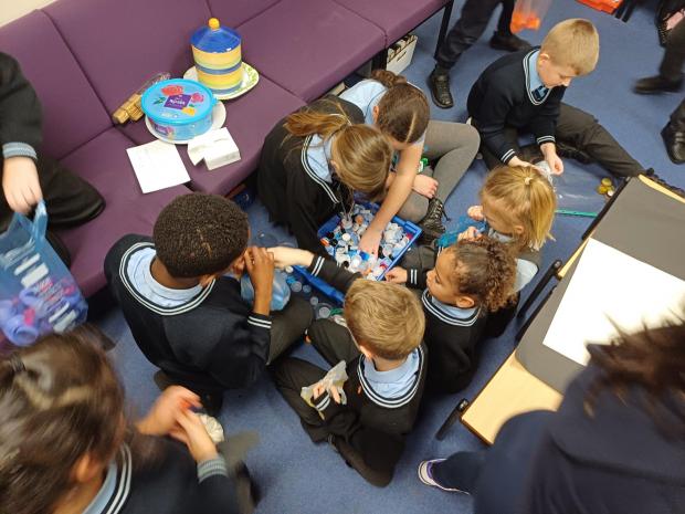 Children organising lids